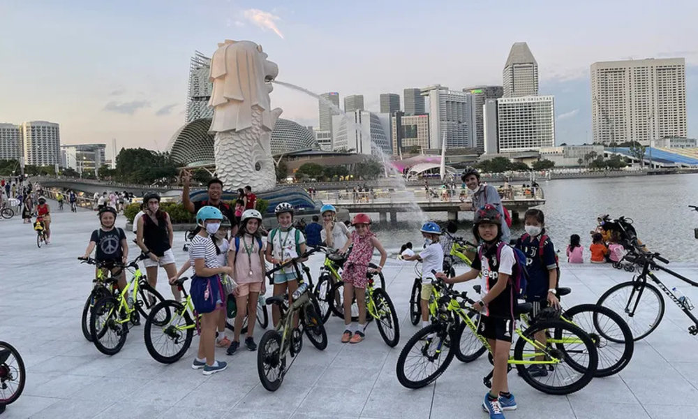 Tourist riding a bike in Marina Bay