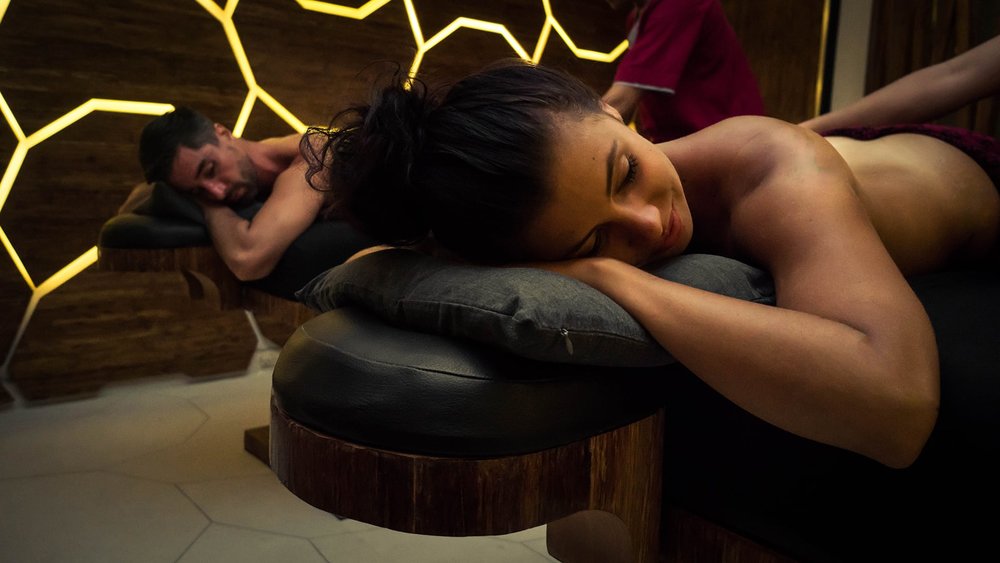 A man and a woman getting a massage