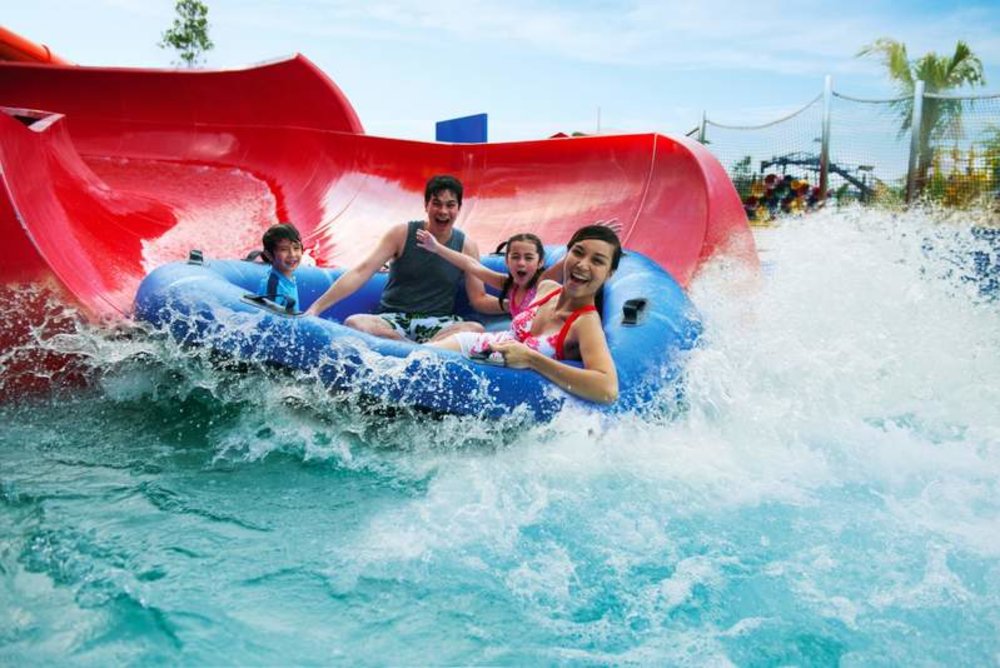 family sliding in donut inflatable