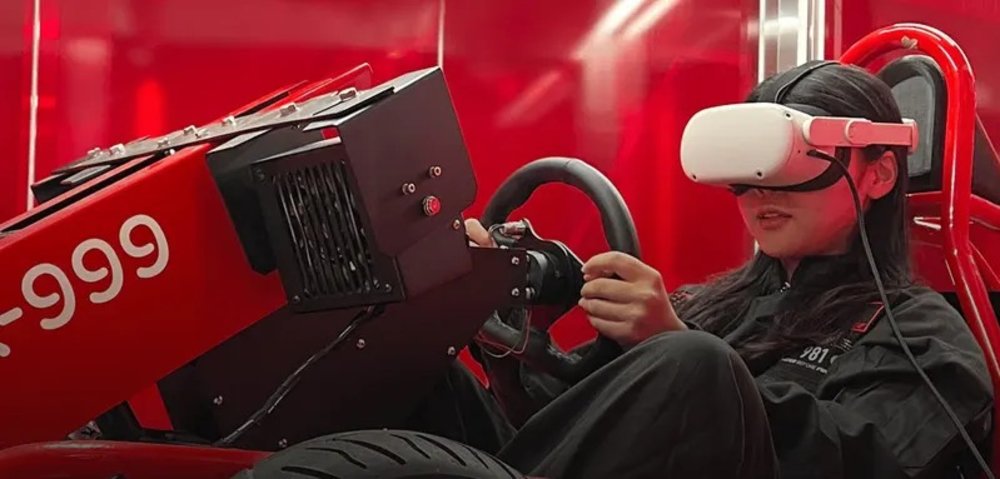 Woman wearing VR goggles while on a go-kart