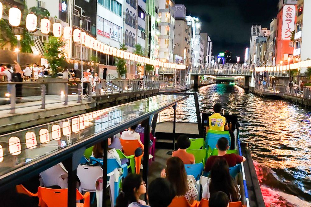 a river cruise along dotonbori at night