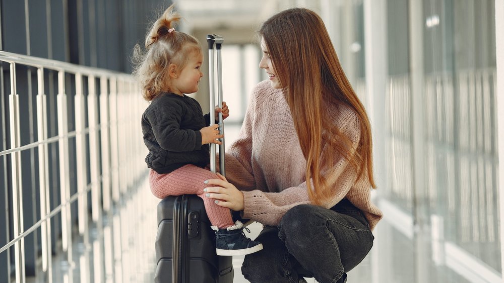 mom and baby daughter at the airport