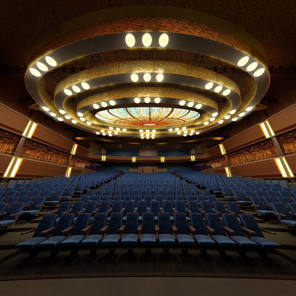 An empty hall with blue seats