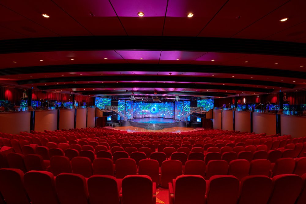 Empty hall with red chairs