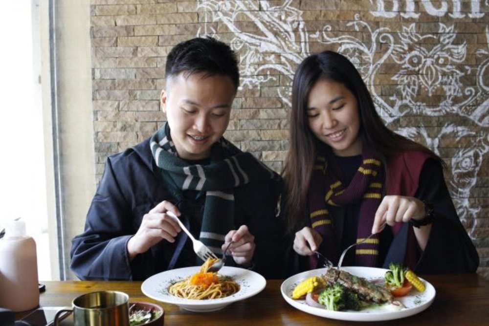 Man and woman happily eating