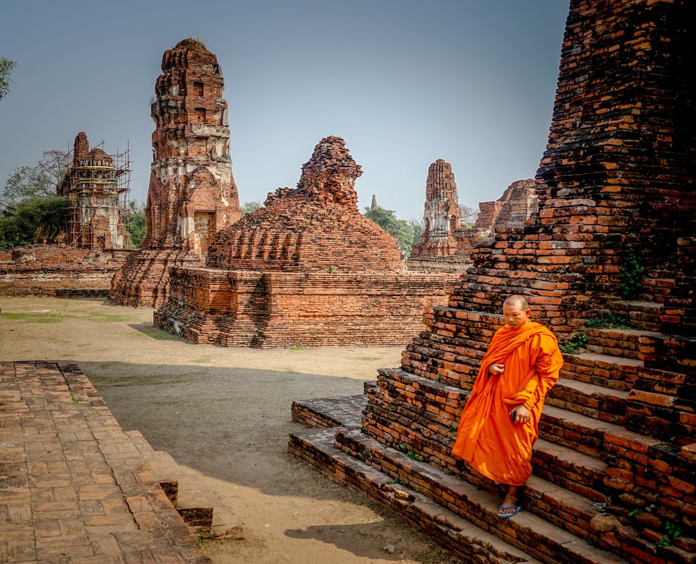 A monk sitting by the steps