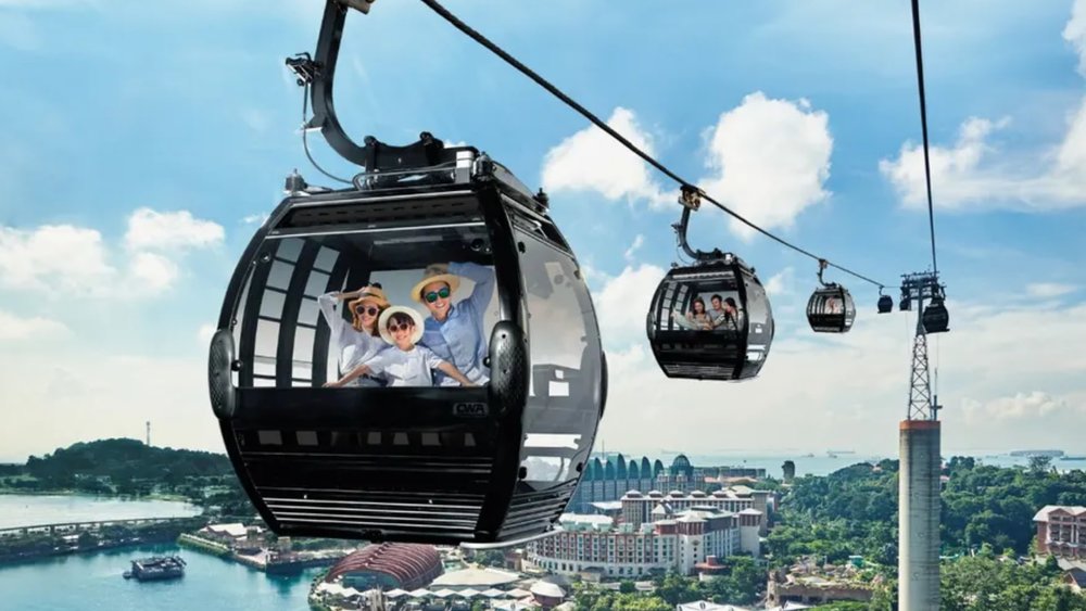 family riding the cable car to Sentosa Island