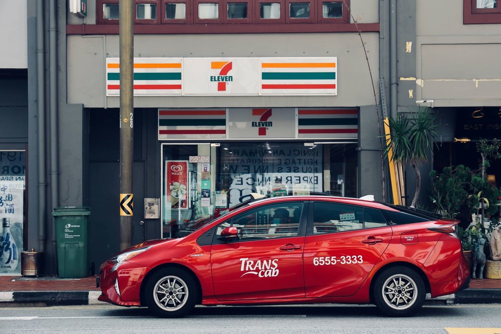 A Taxi Waiting in front of a 7-11 store in Singapore - Jiachen Lin on Unsplash