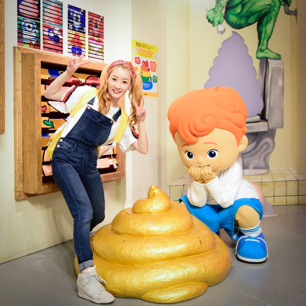 Girl with a big poop art