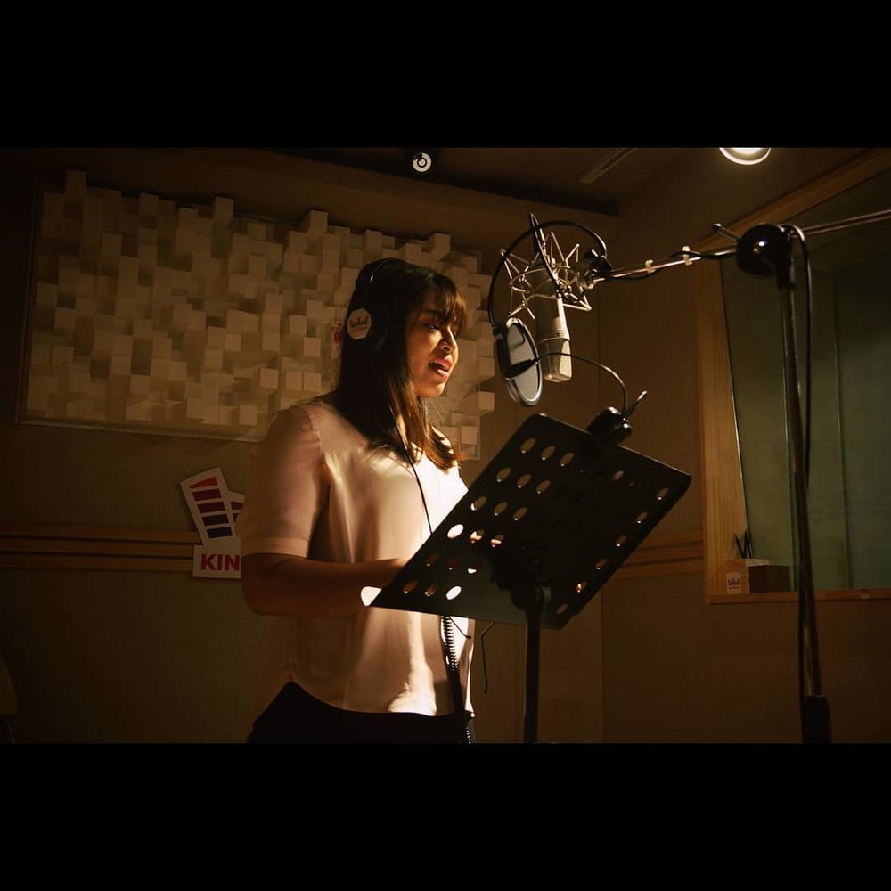 Girl recording a song