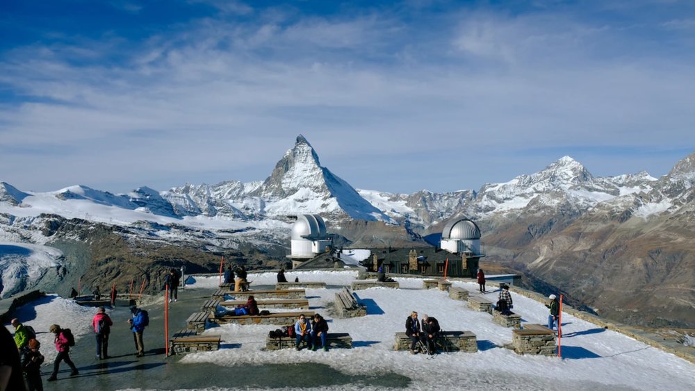 Just you, the mountains, and the clouds. Credits to Young Shih on Unsplash