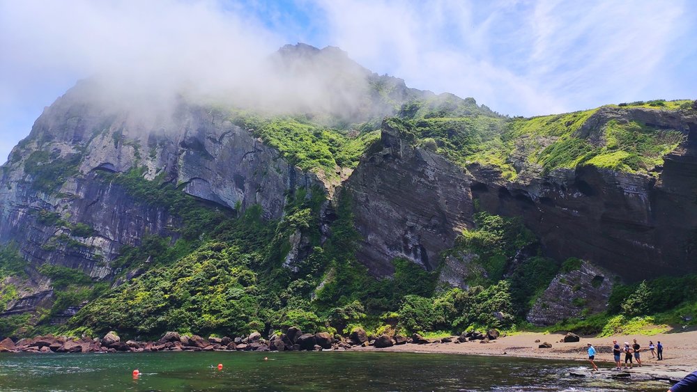 Watch the sunrise at Seongsan Ilchulbong! Credits to Adnan Ami on Unsplash