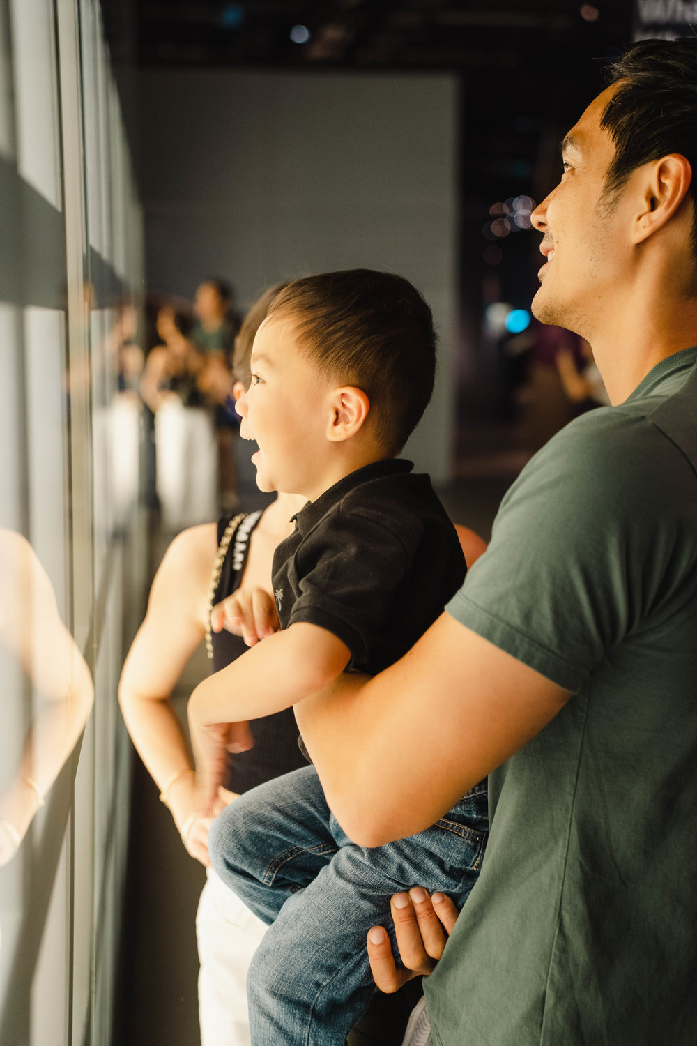 boy smiling at museum feature