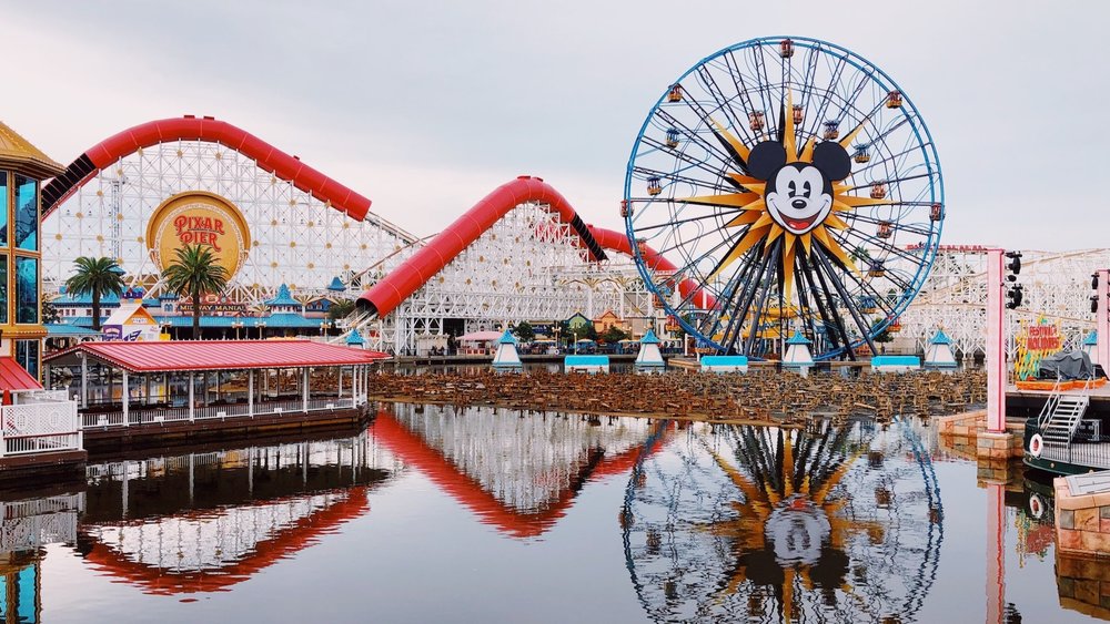 Take a photo with the iconic Mickey Mouse ferris wheel. Photo credits to Brandi Alexandra on Unsplash.