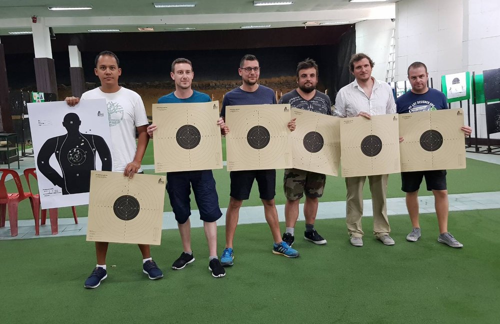 Guys holding target boards
