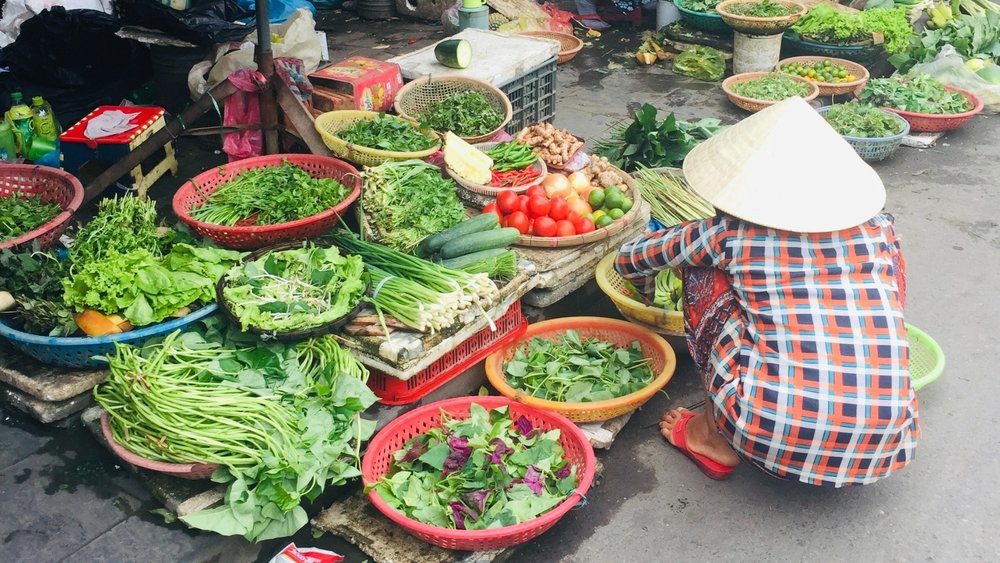 Don't forget to visit Vietnam's markets, like Ben Tanh Market in Ho Chi Minh City, at your stops! Credits to Olga Vel on Unsplash.