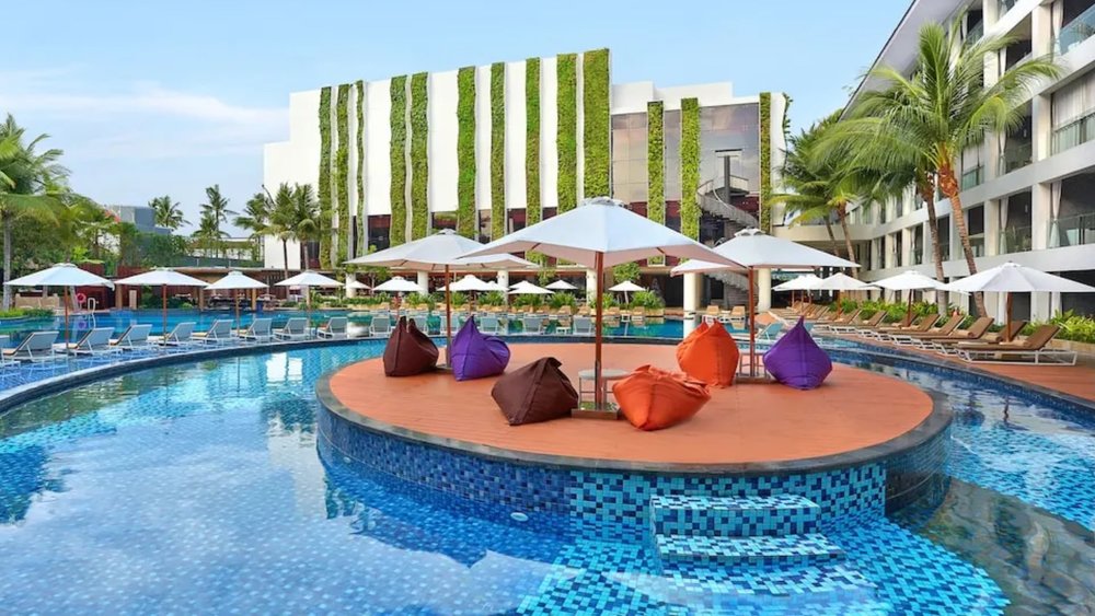 Relax on the beanbag island with a book and a refreshing cocktail under the Bali sun.