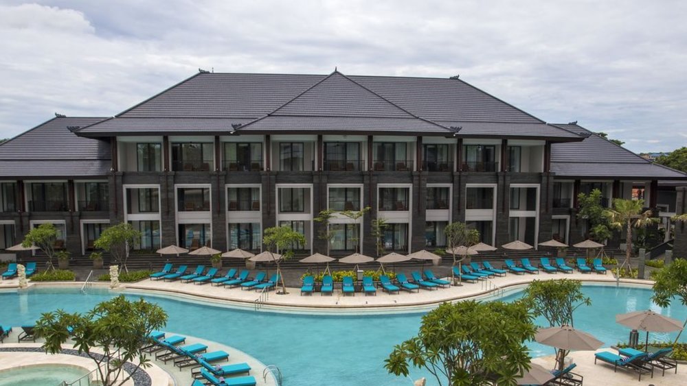 Eat a delicious meal to start the night at their swim-up bar.