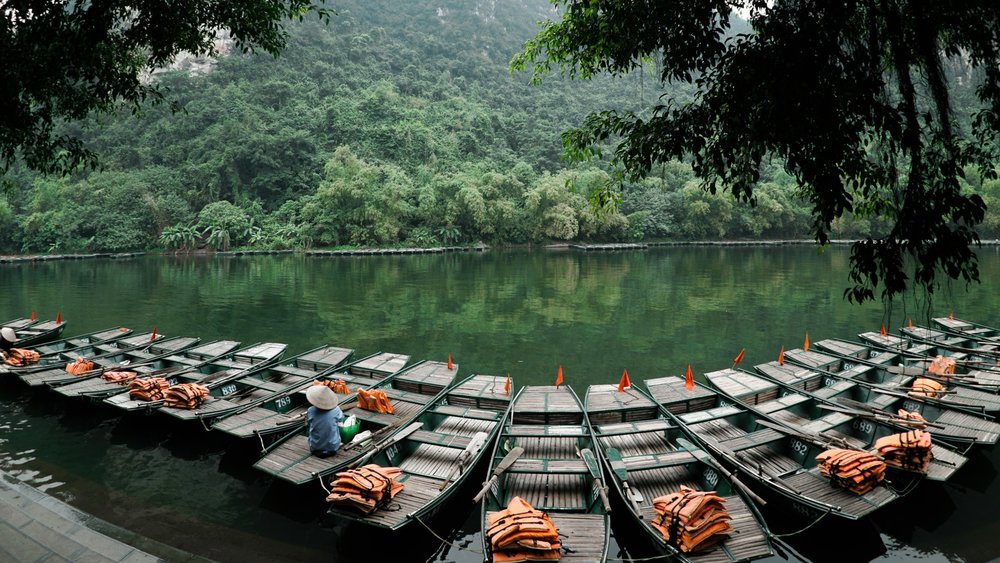 Embark on a serene journey as you sail away on the tranquil rivers of Ninh Binh. Credits: @ruslanbardash on Unsplash
