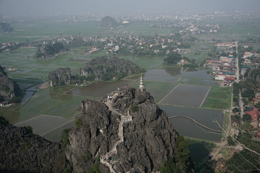 an aerial view of a mountain with a castle on top