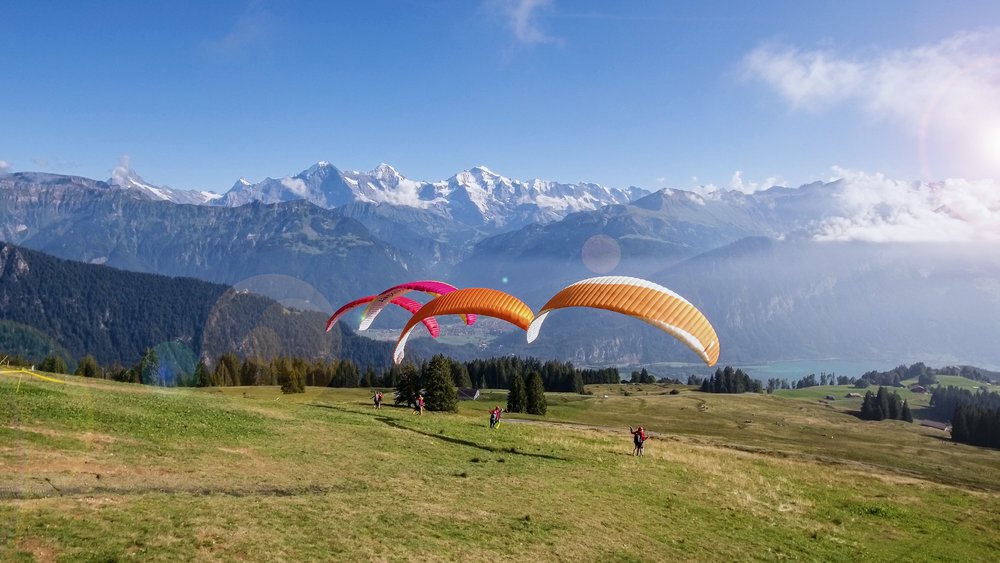 paragliding among the snow-capped mountains