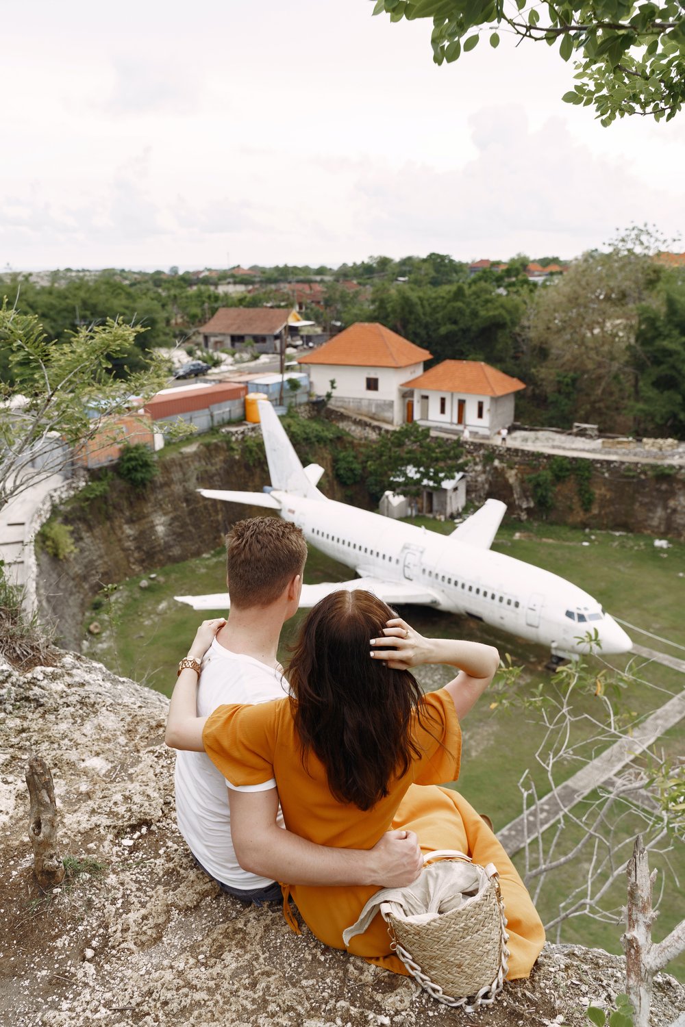 Couple sitting in a cliff