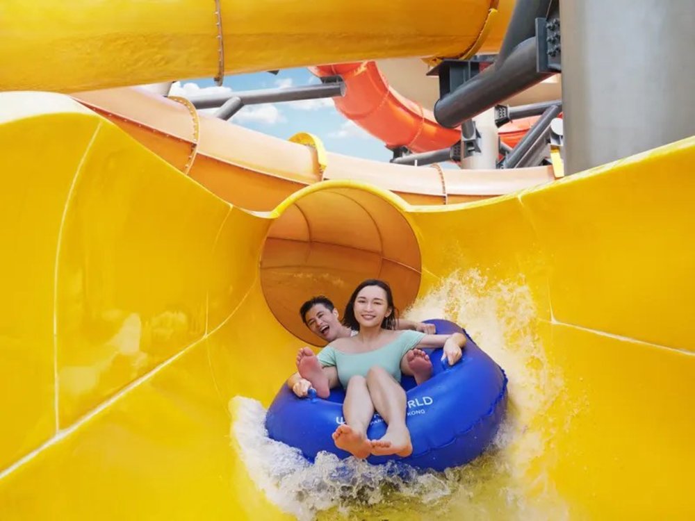 Couple going down in a slide
