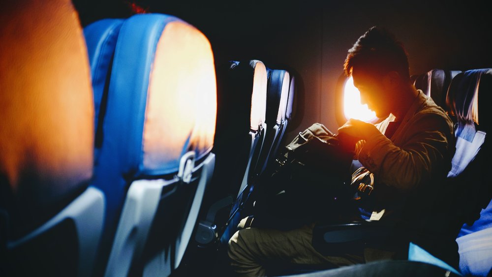 Man shadow sitting inside the airplane