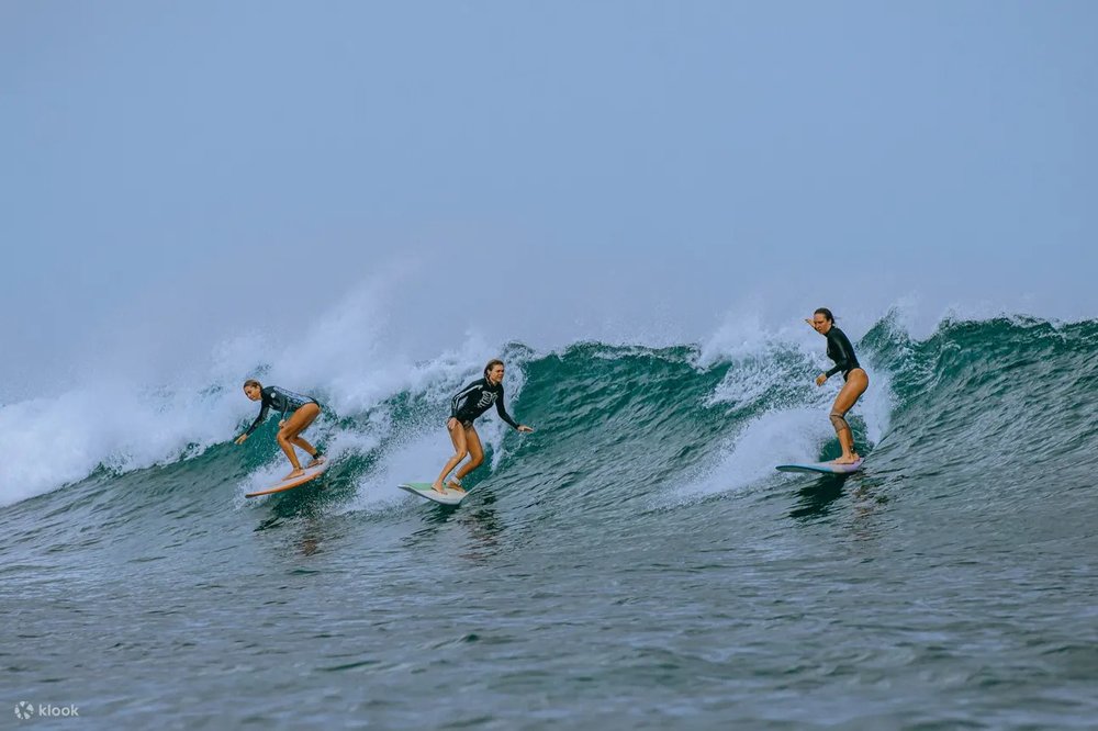 Three woman surfing