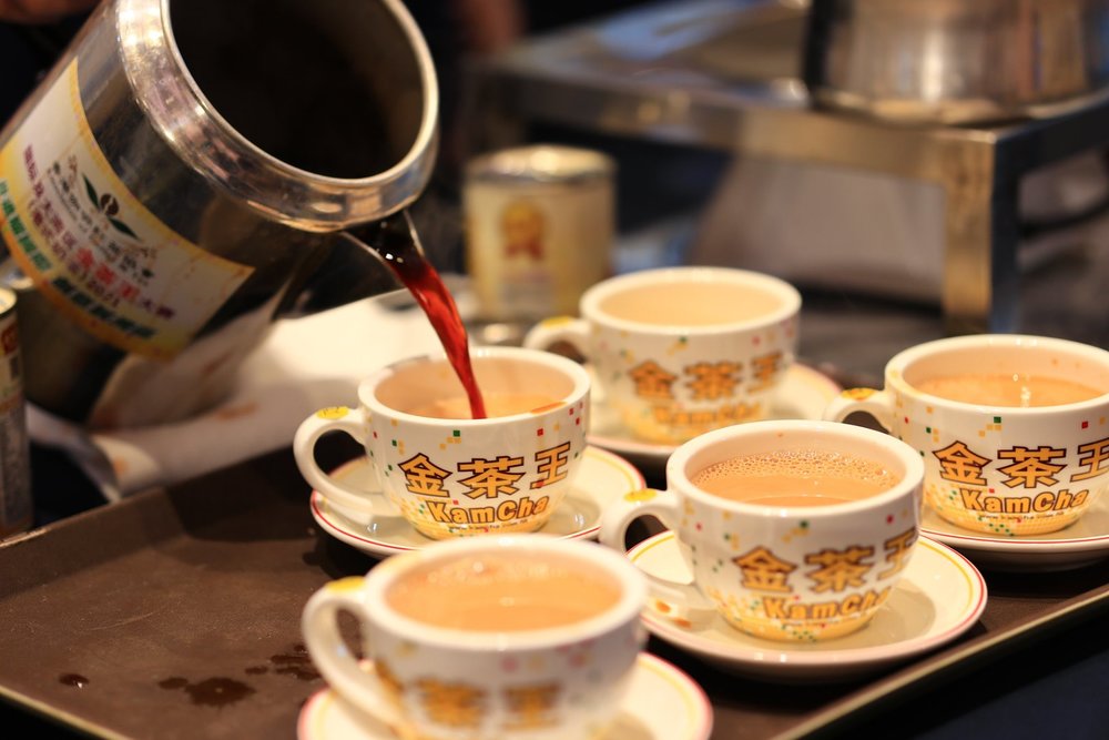 White tea cups with milk tea