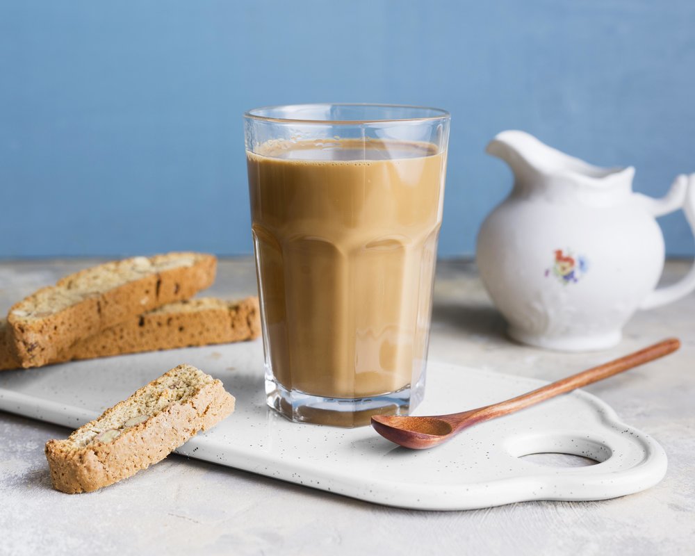 Milk tea with bread and spoon