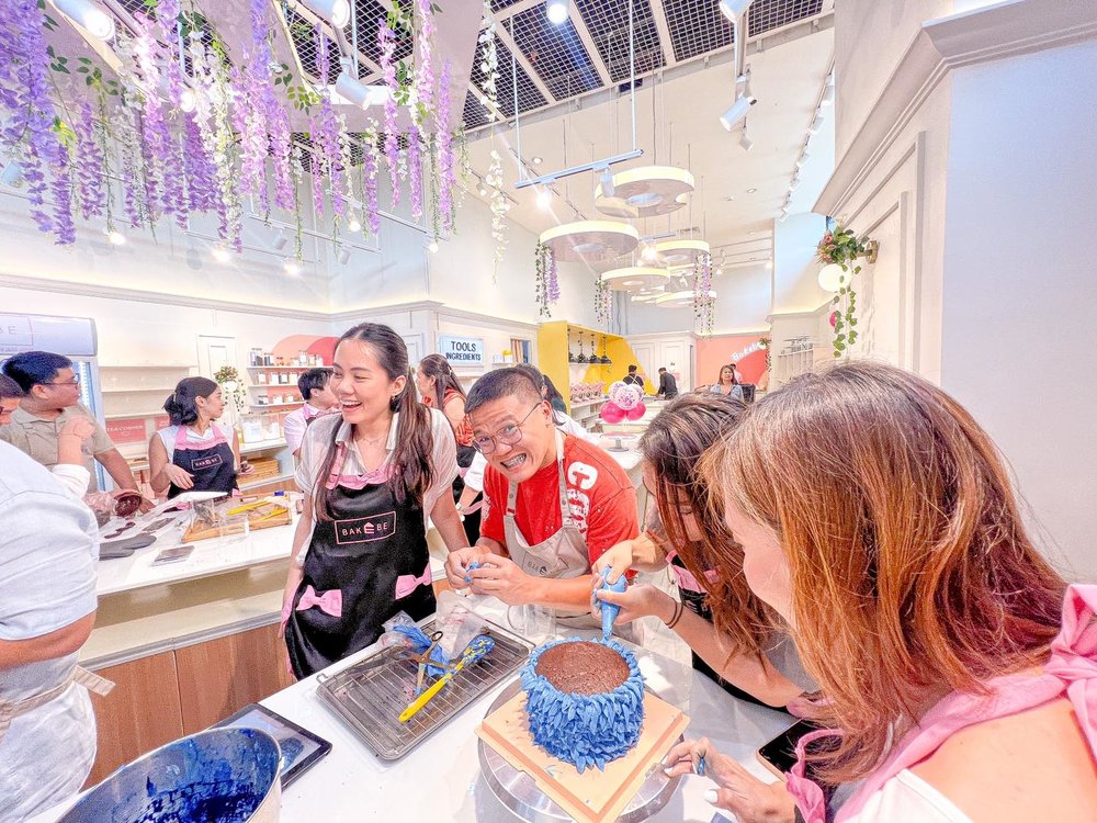 Friends baking a cake