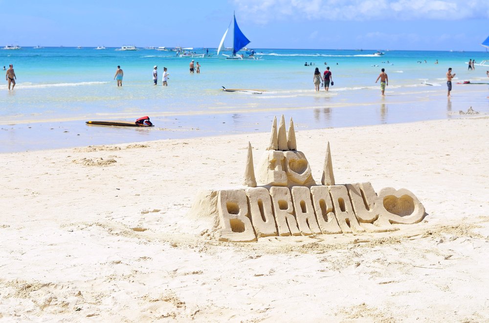 Boracay beach with signage made of sands