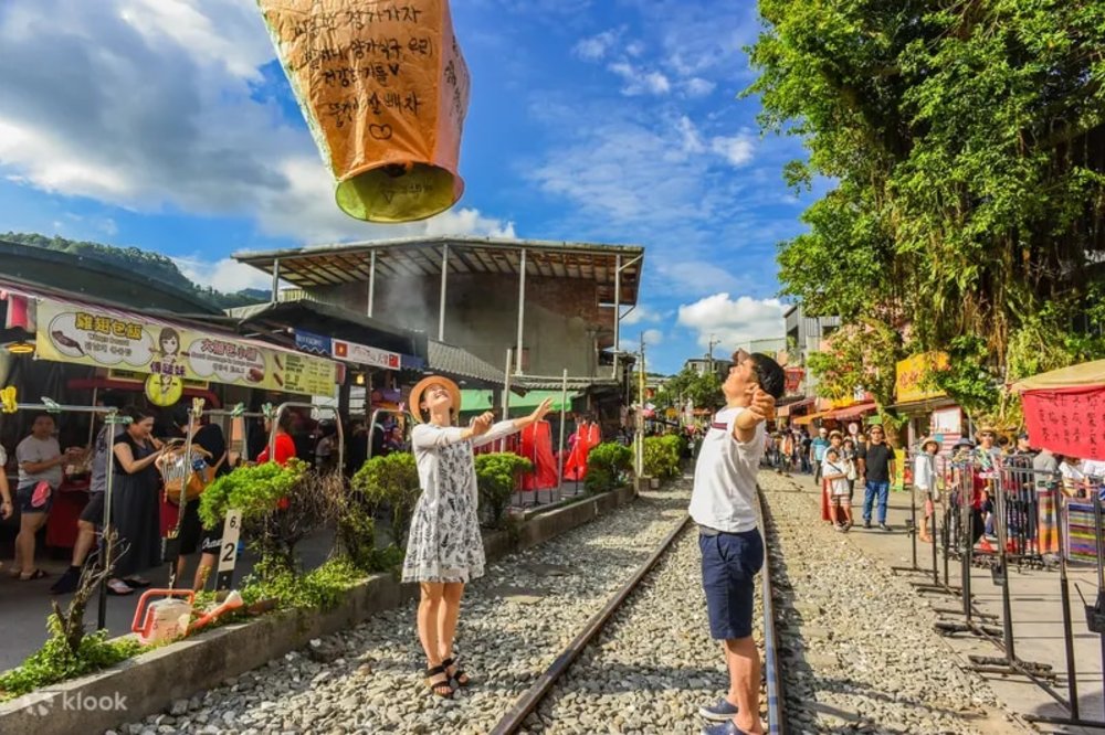 Tourists watching their lantern fly