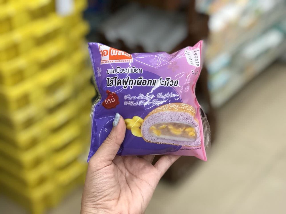 Person holding a durian filled sweet bun