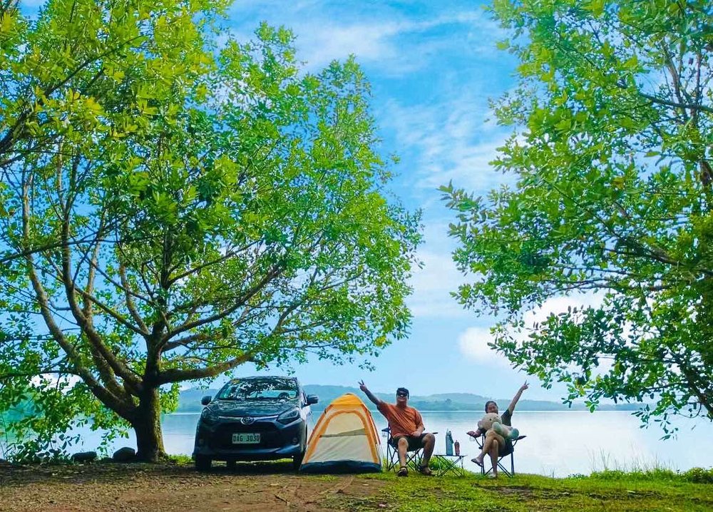 Couple camping near the lake