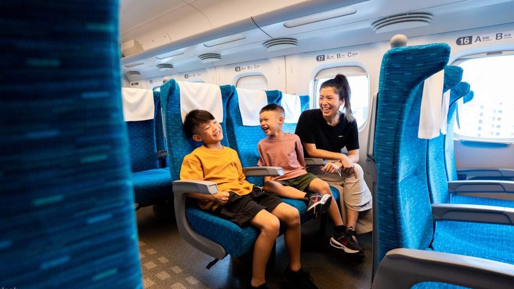 Family traveling in a train at Japan