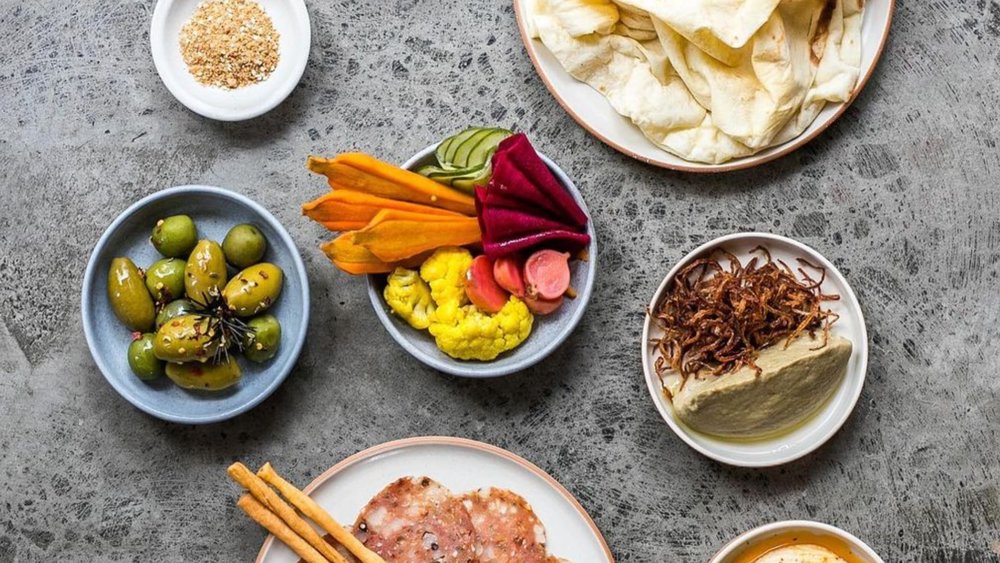 Cocktails and Mediterranean fare in an airy, stylish space that has a wood-fired oven and a terrace.  Credits: @mason.bali on Instagram