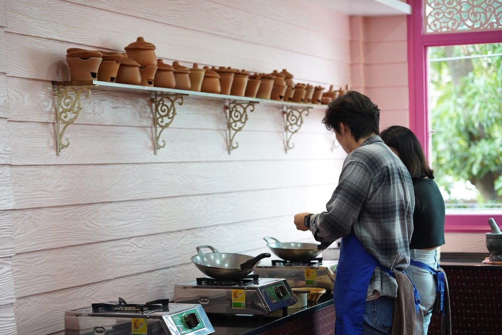Man and woman cooking together