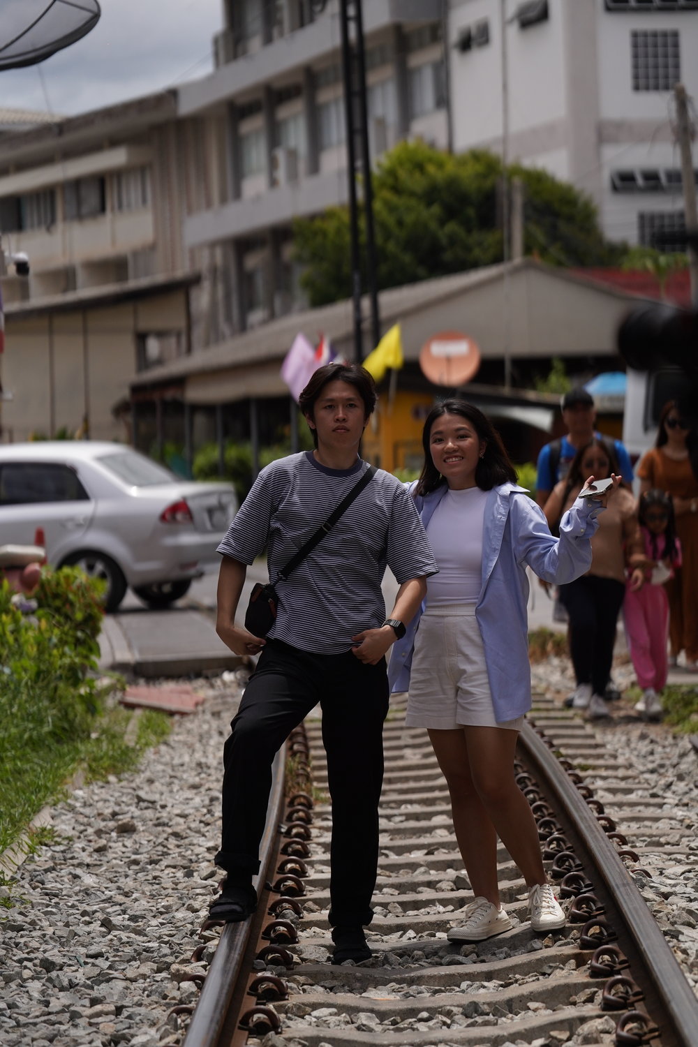 Man and woman standing on a railway