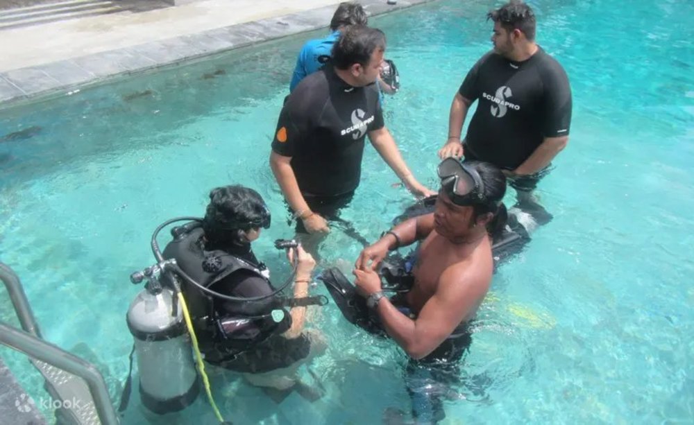 Scuba divers training in a pool