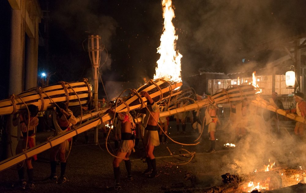 Japanese carrying a big torch
