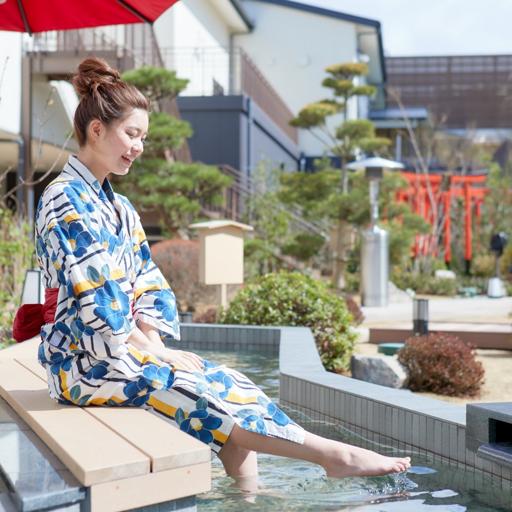 Girl beside hotspring