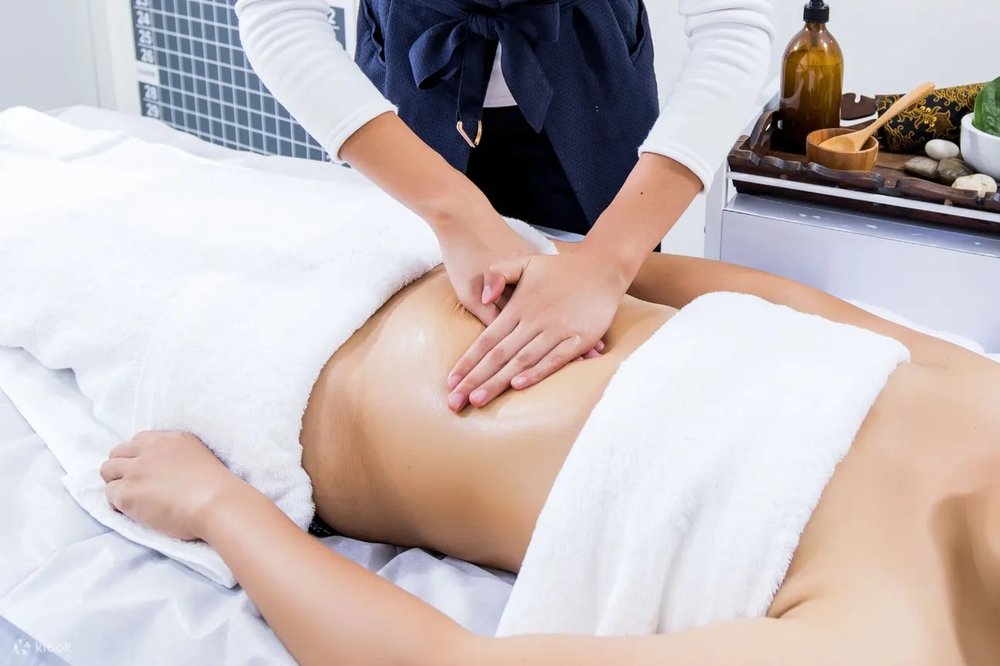 Masseur massaging the belly