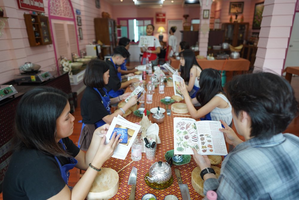 Man and woman looking at cookbooks