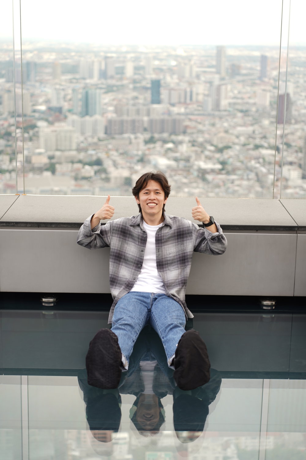 Man sitting on the skywalk