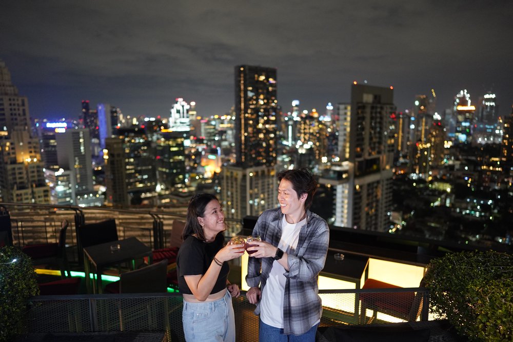 Man and woman clinking their glasses
