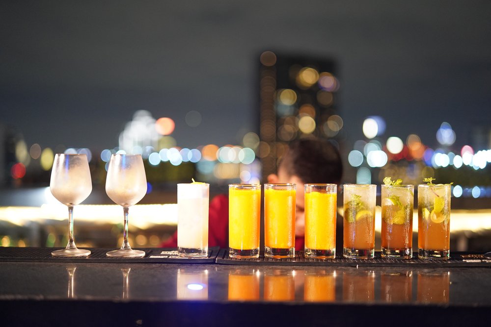 Different drinks lined up at the bar
