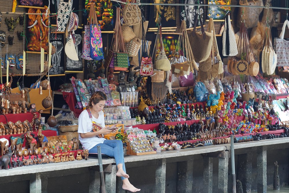 Woman selling bags and elephant miniatures