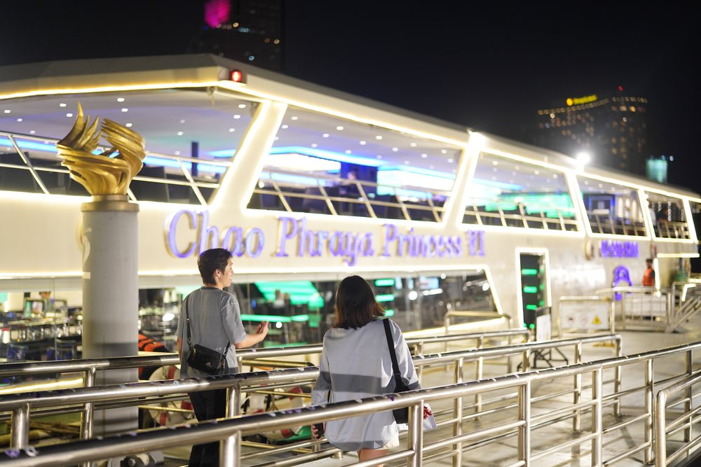 Man and woman walking towards a boat